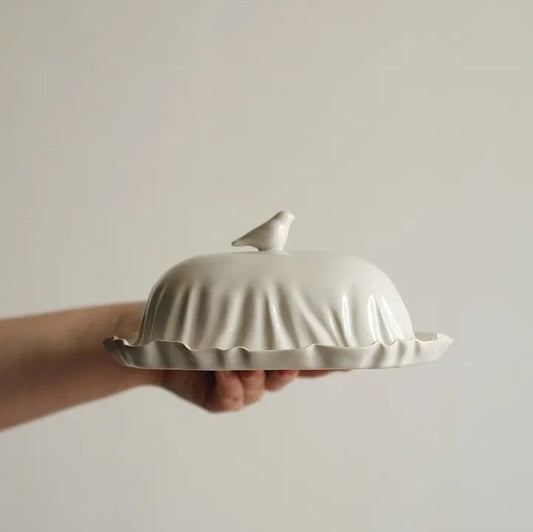 Handmade butter dish with a bird on the lid